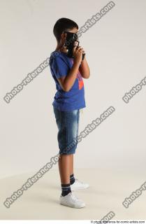 TIMBO STANDING POSE WITH GUN